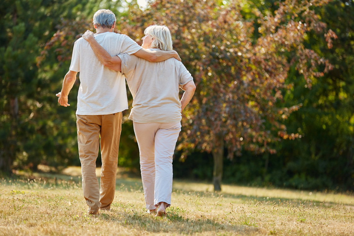 Two Seniors Go for a Walk in Summer